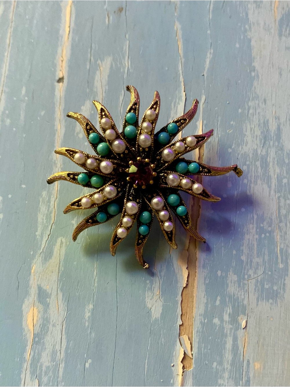Gold-Tone Sunburst Brooch with Turquoise and Pearl Accents
